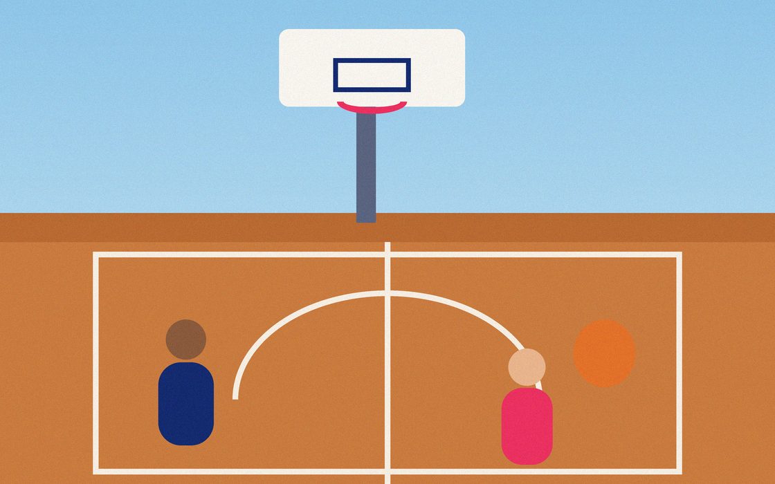 An outdoor basketball court with fresh white nets on both hoops.