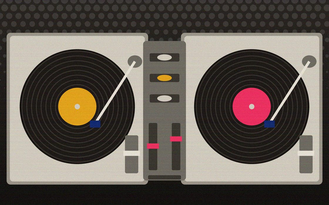 Two turntables and a mixer set up next to a crate of records